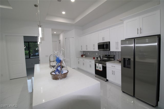 kitchen featuring white cabinetry, a kitchen island with sink, and appliances with stainless steel finishes