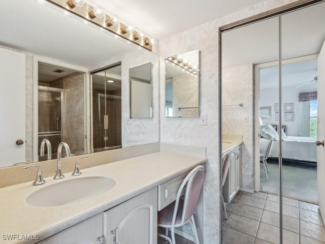 bathroom with tile patterned flooring and vanity