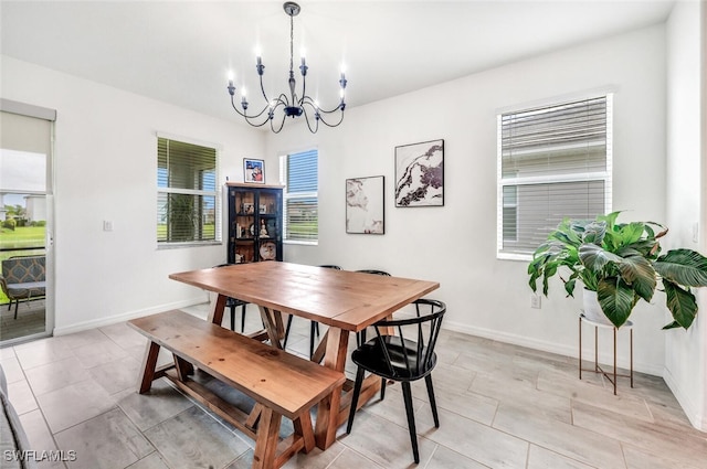 dining area with an inviting chandelier