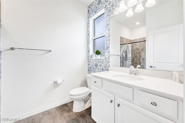 bathroom with vanity, toilet, and a shower with shower curtain