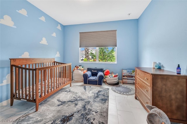 bedroom with a nursery area