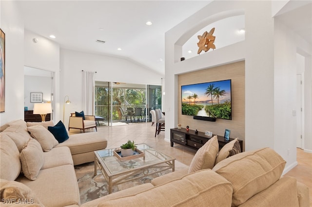 tiled living room featuring vaulted ceiling