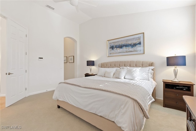 carpeted bedroom featuring lofted ceiling and ceiling fan