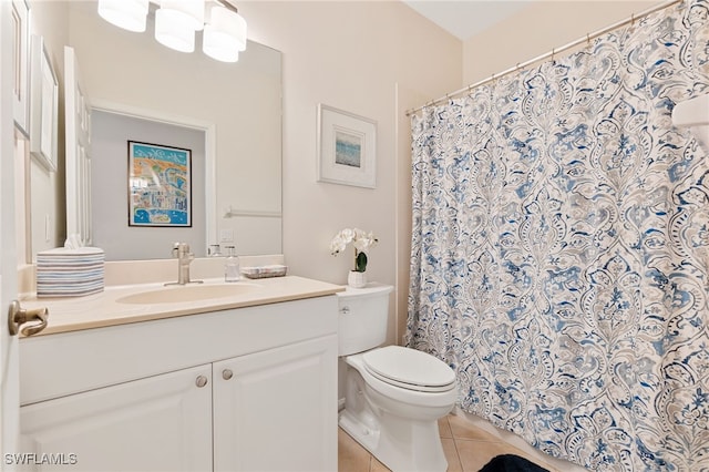 bathroom with walk in shower, tile patterned floors, toilet, and vanity