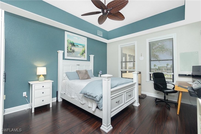 bedroom with ceiling fan and dark hardwood / wood-style flooring