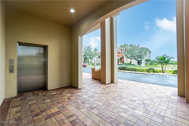 view of patio featuring elevator