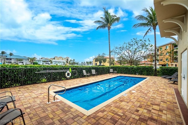 view of swimming pool with a patio area