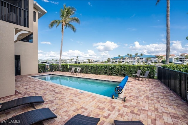 view of pool featuring a patio area