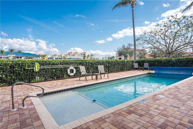 view of pool featuring a patio area