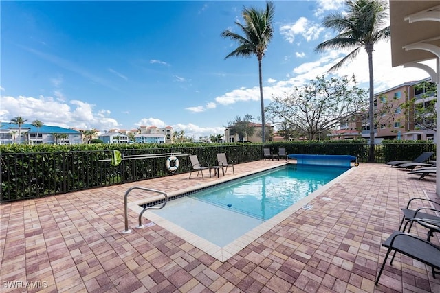 view of swimming pool with a patio area