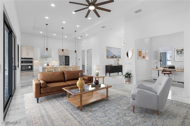 living room with a towering ceiling