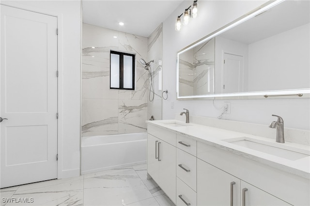 bathroom with vanity and tiled shower / bath combo