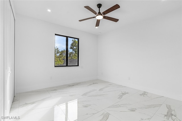 spare room with ceiling fan