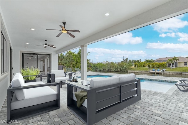 view of patio with an outdoor living space and ceiling fan