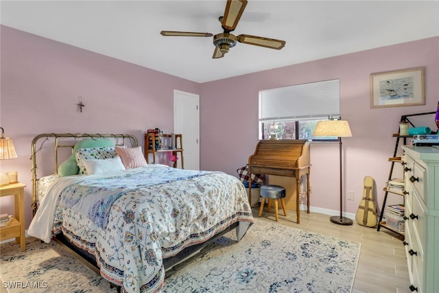 bedroom featuring light wood-type flooring and ceiling fan