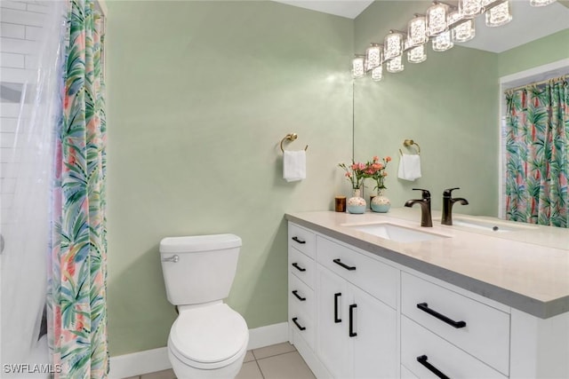 bathroom with vanity, toilet, and tile patterned flooring