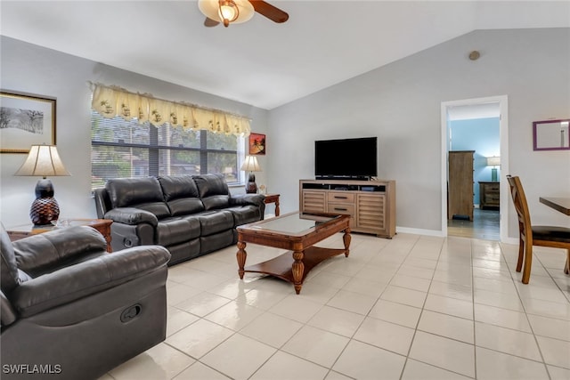 living room featuring ceiling fan, lofted ceiling, and light tile patterned floors