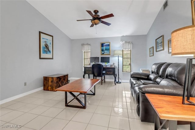 tiled living room featuring ceiling fan and vaulted ceiling