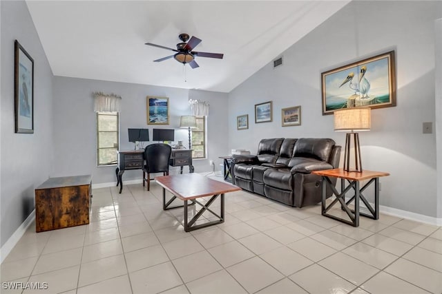 tiled living room featuring ceiling fan and lofted ceiling