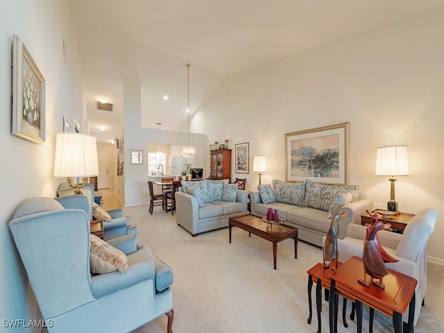 living room with sink, light carpet, and high vaulted ceiling