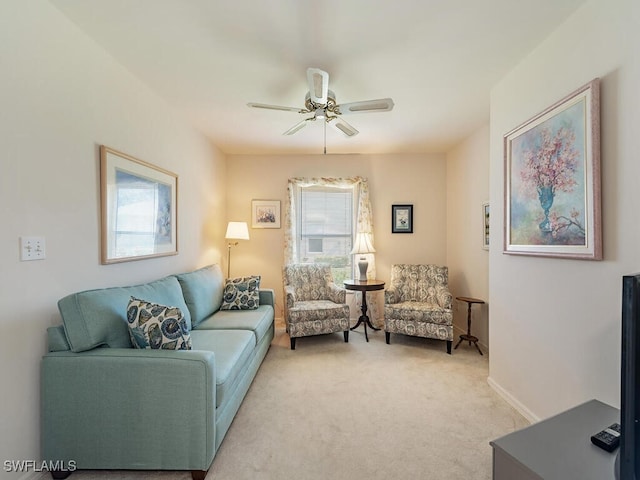 living room featuring ceiling fan and light colored carpet