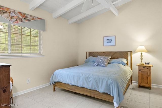 bedroom with vaulted ceiling with beams, light tile patterned flooring, and baseboards