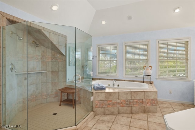 bathroom featuring a shower stall, a bath, tile patterned flooring, and vaulted ceiling