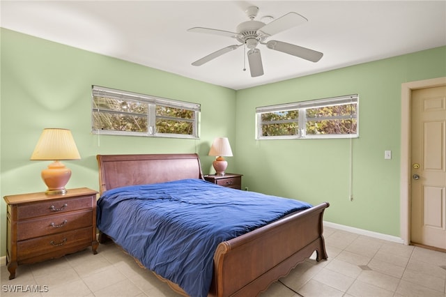 bedroom featuring baseboards and ceiling fan