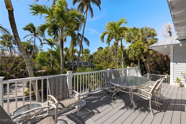 wooden deck with outdoor dining space