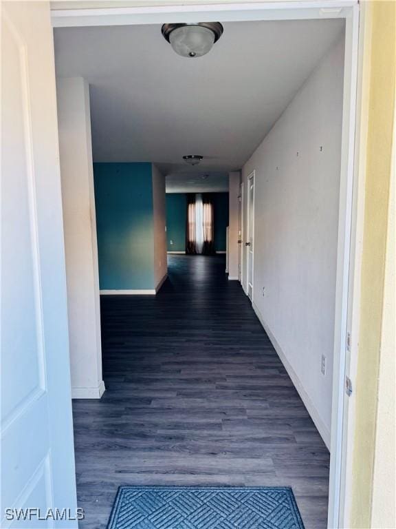 hallway featuring dark hardwood / wood-style flooring