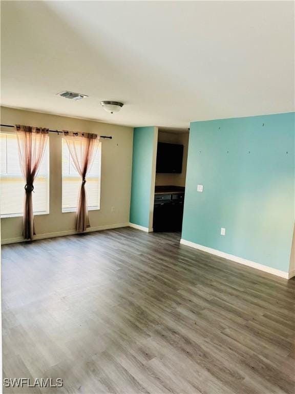 empty room with hardwood / wood-style floors