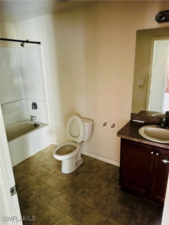 full bathroom featuring shower / tub combination, vanity, and toilet