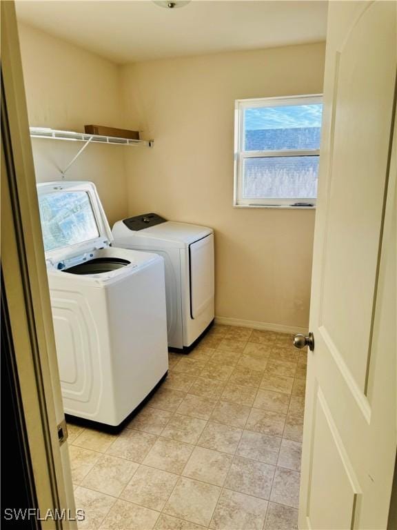 washroom featuring washer and clothes dryer