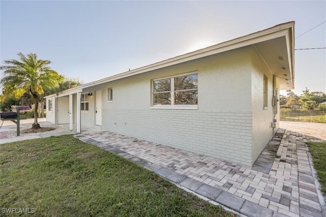 view of home's exterior featuring a yard