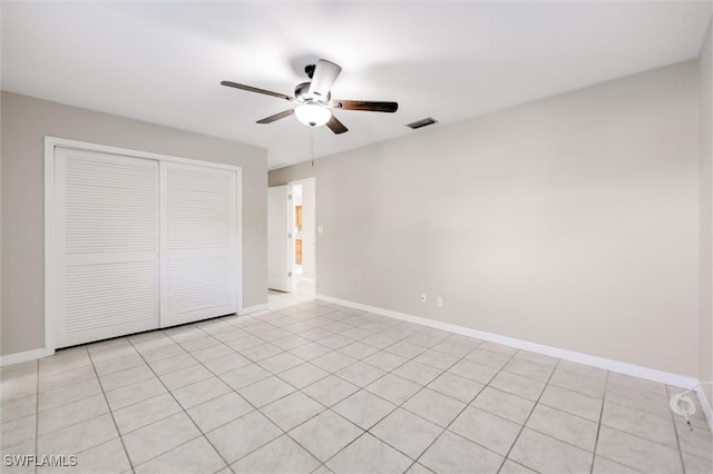 unfurnished bedroom with a closet and ceiling fan