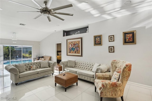 living room with ceiling fan, vaulted ceiling, and light tile patterned floors