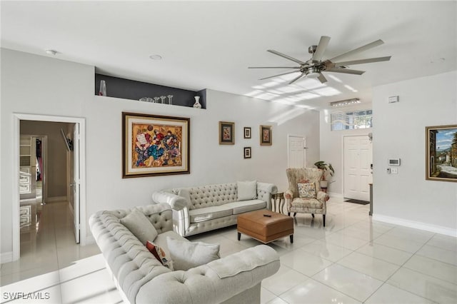 tiled living room with ceiling fan