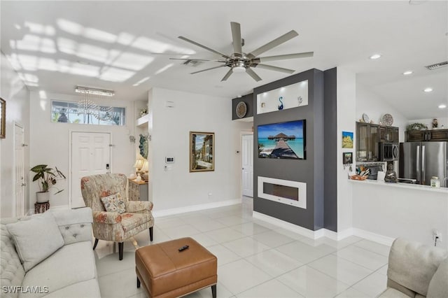 tiled living room with lofted ceiling and ceiling fan