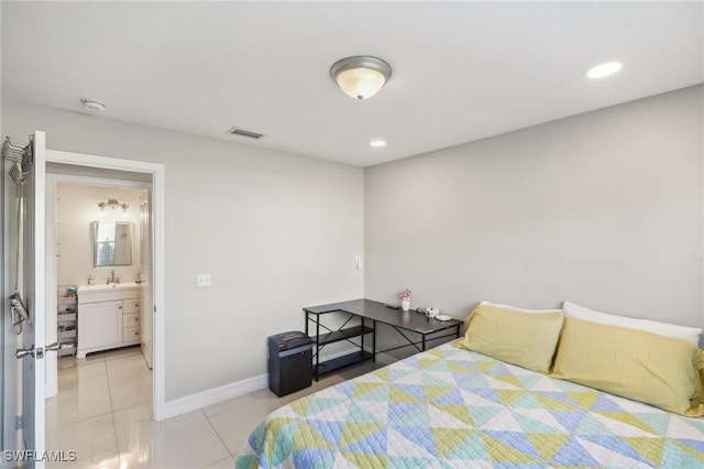 bedroom with sink and light tile patterned flooring