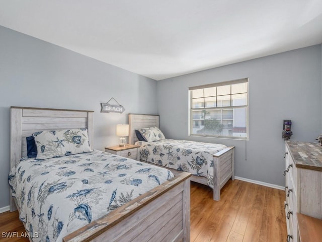 bedroom with light wood-type flooring