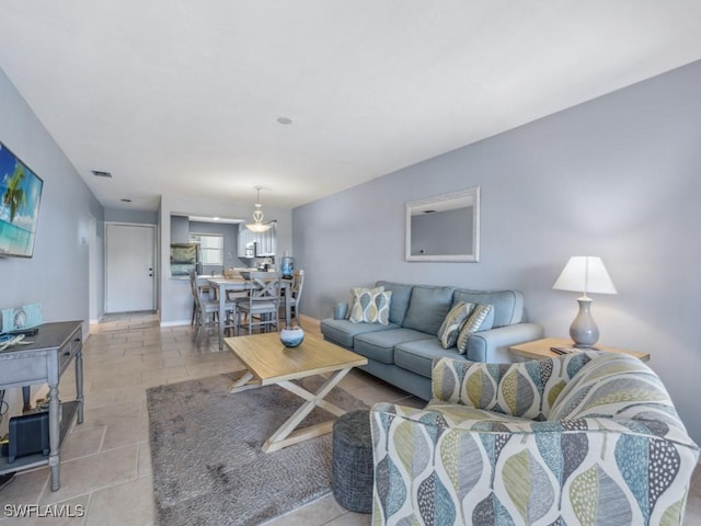 living room with light tile patterned floors