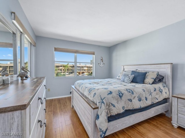 bedroom with light hardwood / wood-style floors