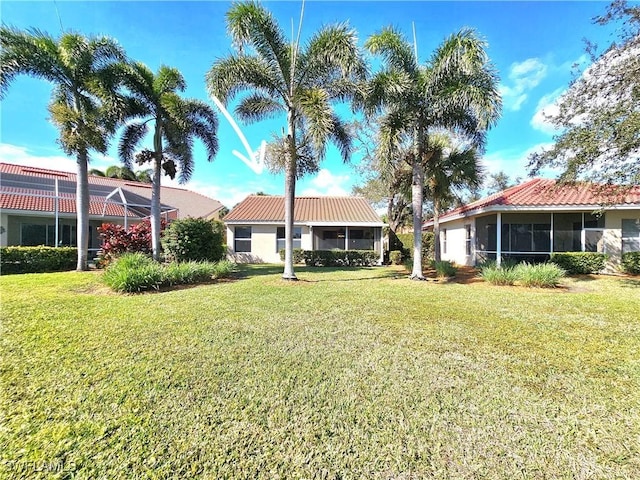 view of yard featuring a sunroom