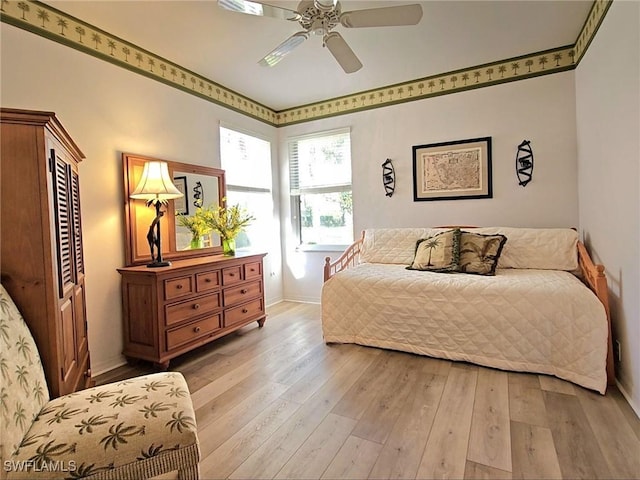 bedroom featuring ceiling fan and light hardwood / wood-style flooring