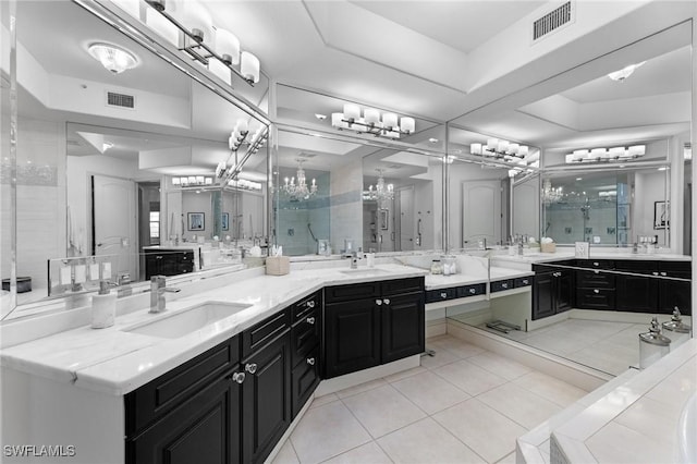 bathroom with vanity, tile patterned floors, a shower with door, and a tray ceiling