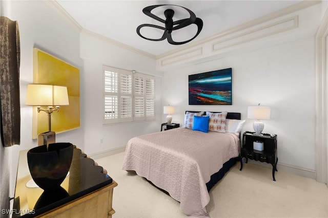 bedroom featuring ornamental molding and carpet