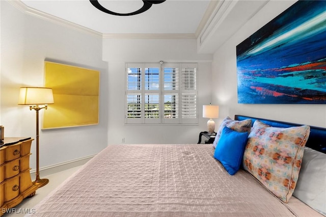 bedroom with light carpet and crown molding