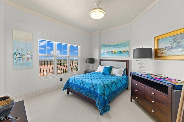 bedroom featuring ornamental molding, light colored carpet, and a textured ceiling