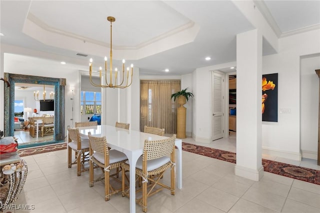 dining space featuring a notable chandelier, crown molding, a raised ceiling, and light tile patterned flooring