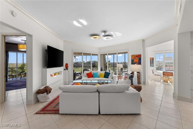 tiled living room featuring ornamental molding and a wealth of natural light